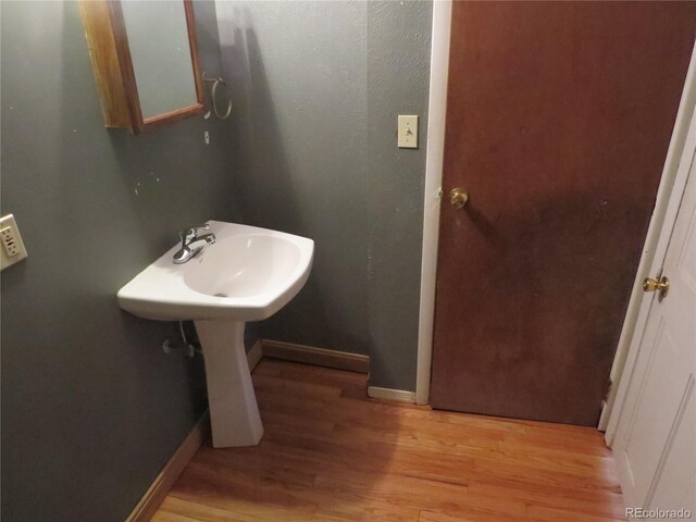 135 E 2nd St, Nederland, CO 80466 - bathroom with wood finished floors and baseboards