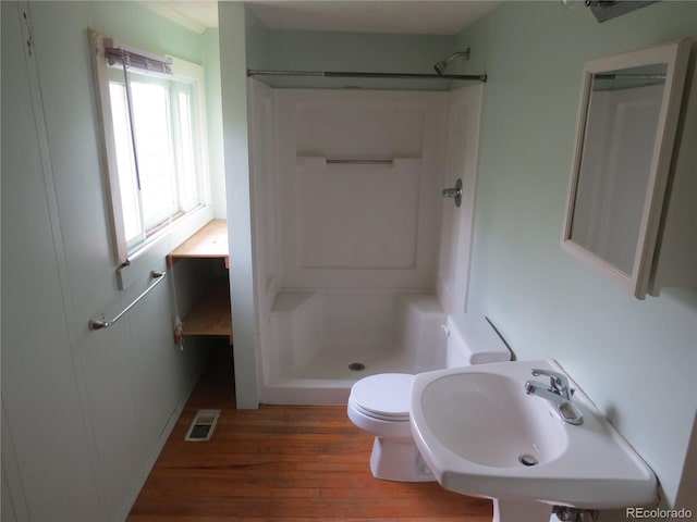 135 E 2nd St, Nederland, CO 80466 - full bathroom with a stall shower and wood finished floors