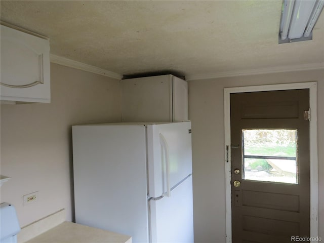 135 E 2nd St, Nederland, CO 80466 - kitchen with freestanding refrigerator and crown molding