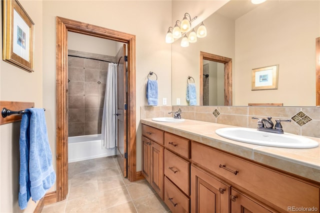 bathroom with tile patterned floors, shower / bathtub combination with curtain, decorative backsplash, and vanity