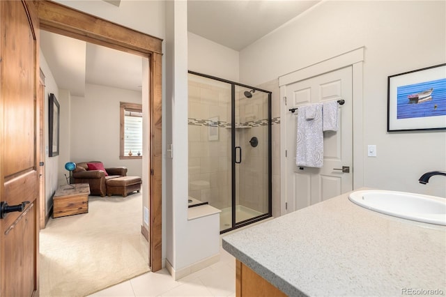 bathroom featuring vanity, tile patterned floors, and a shower with door