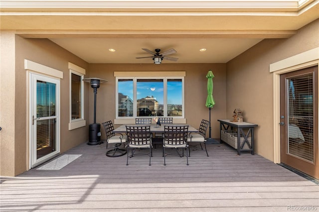 wooden terrace featuring ceiling fan