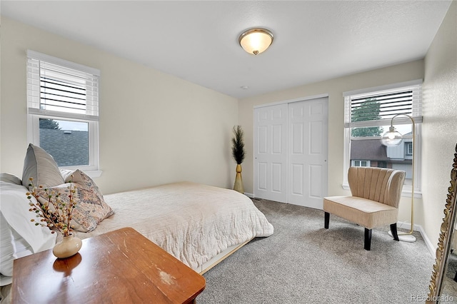 carpeted bedroom with a closet