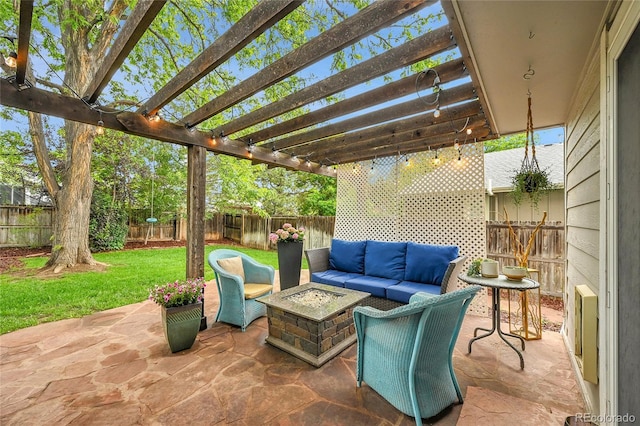 view of patio with an outdoor living space with a fire pit