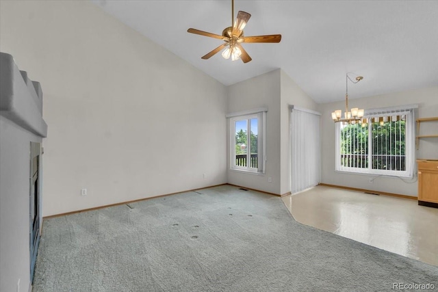 5960 S Estes St, Littleton, CO 80123 - carpeted spare room featuring a chandelier, ceiling fan, baseboards, and high vaulted ceiling