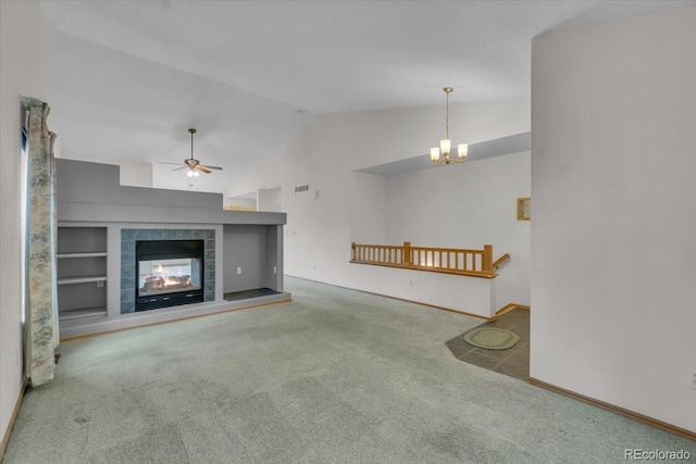 5960 S Estes St, Littleton, CO 80123 - unfurnished living room featuring carpet floors, vaulted ceiling, baseboards, a ceiling fan, and a chandelier
