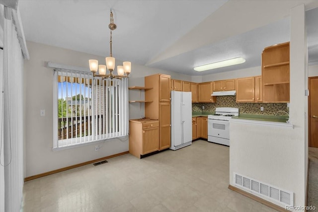 5960 S Estes St, Littleton, CO 80123 - kitchen with white appliances, open shelves, under cabinet range hood, a chandelier, and lofted ceiling