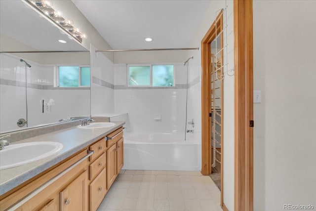 5960 S Estes St, Littleton, CO 80123 - full bathroom featuring bathtub / shower combination, healthy amount of natural light, tile patterned floors, double vanity, and recessed lighting