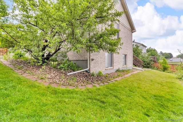 5960 S Estes St, Littleton, CO 80123 - view of home's exterior featuring brick siding and stairs