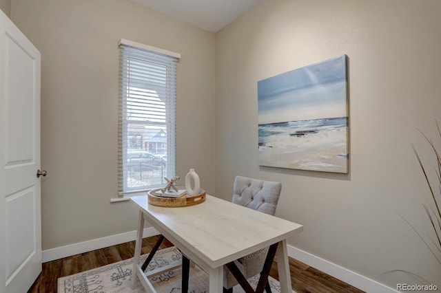 office area with baseboards and wood finished floors