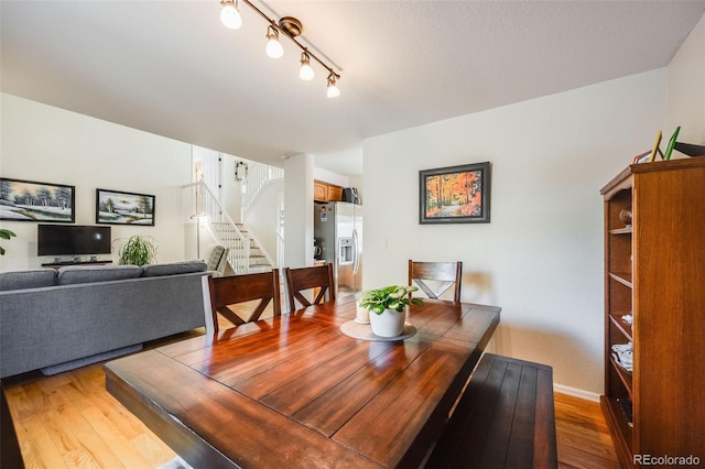 dining area with hardwood / wood-style floors