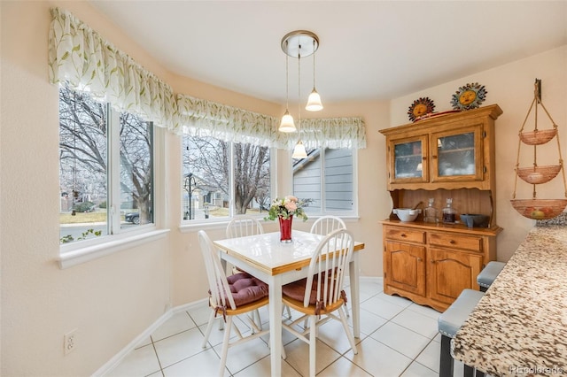 dining space with light tile patterned flooring