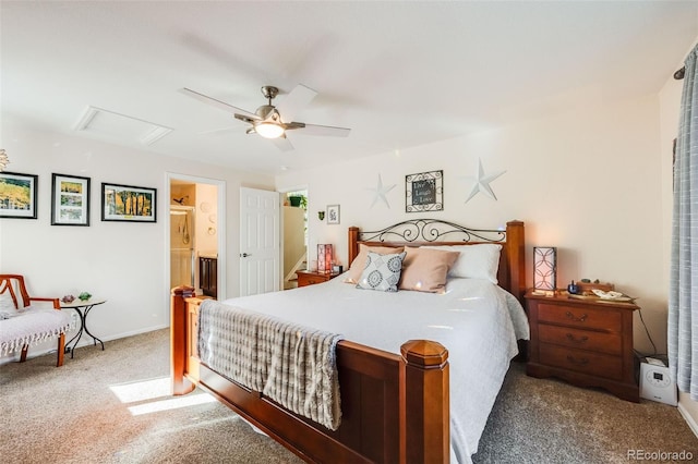 carpeted bedroom with ensuite bath and ceiling fan