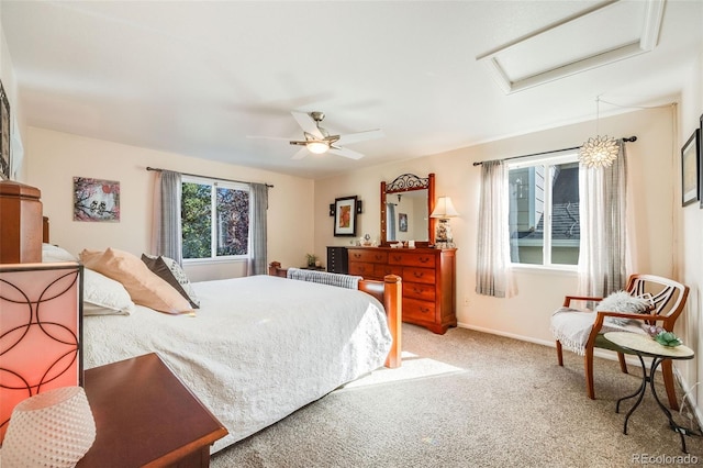 bedroom with ceiling fan and light carpet