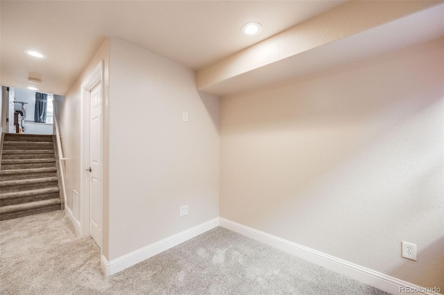 basement with light colored carpet