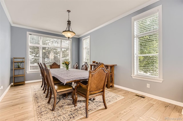 7866 Witney Pl, Lone Tree, CO 80124 - dining area featuring crown molding, light wood-style flooring, and plenty of natural light