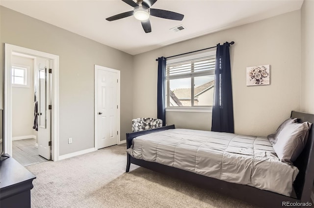 7866 Witney Pl, Lone Tree, CO 80124 - bedroom with light colored carpet, a ceiling fan, and connected bathroom