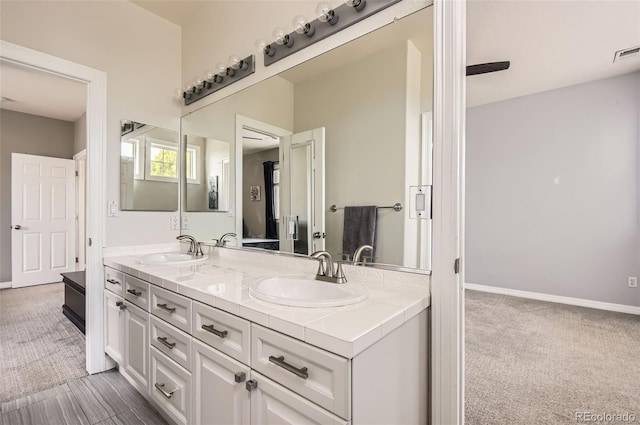 7866 Witney Pl, Lone Tree, CO 80124 - bathroom with double vanity and baseboards