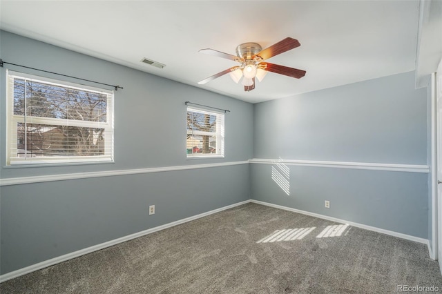 unfurnished room with carpet flooring and ceiling fan