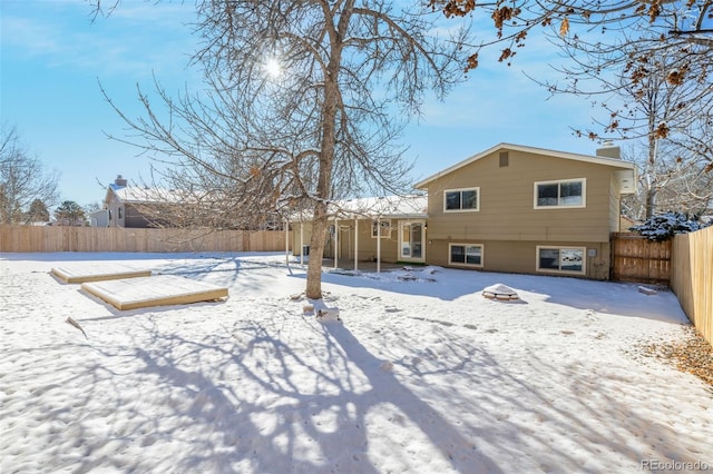 view of snow covered house