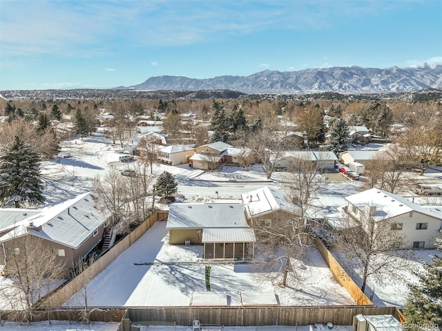 snowy aerial view with a mountain view