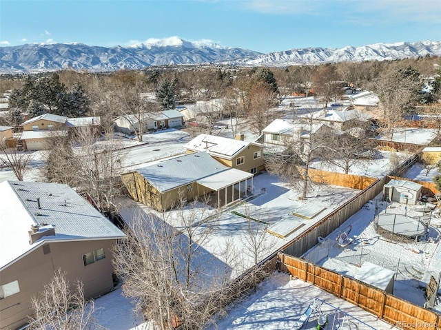 snowy aerial view featuring a mountain view