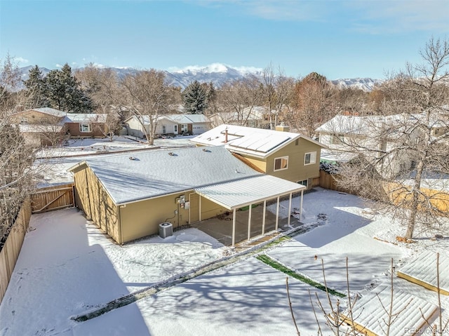 snowy aerial view featuring a mountain view