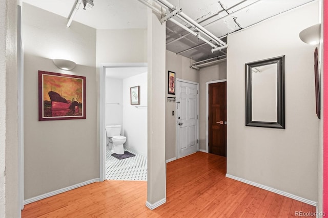 444 17th St Unit 603, Denver, CO 80202 - corridor with baseboards and light wood finished floors
