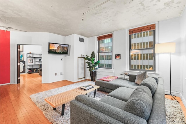 444 17th St Unit 603, Denver, CO 80202 - living room with visible vents and wood-type flooring