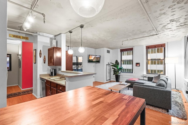 444 17th St Unit 603, Denver, CO 80202 - dining area with rail lighting and light wood-style flooring