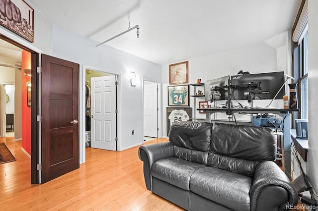 444 17th St Unit 603, Denver, CO 80202 - living room with baseboards and light wood-type flooring