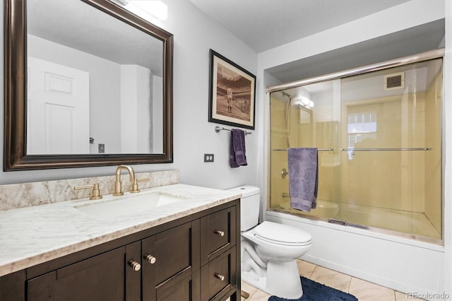 444 17th St Unit 603, Denver, CO 80202 - full bathroom featuring visible vents, toilet, bath / shower combo with glass door, and vanity