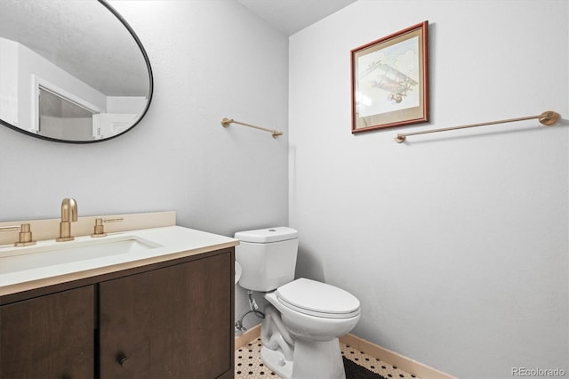 444 17th St Unit 603, Denver, CO 80202 - half bathroom with baseboards, toilet, and vanity
