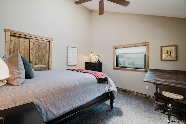 carpeted bedroom featuring high vaulted ceiling and a ceiling fan