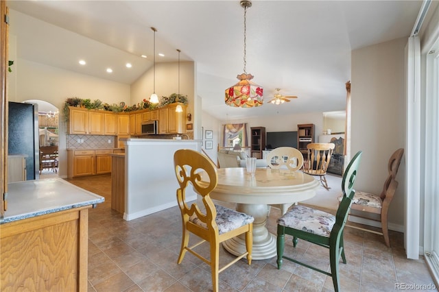 dining space with recessed lighting and lofted ceiling