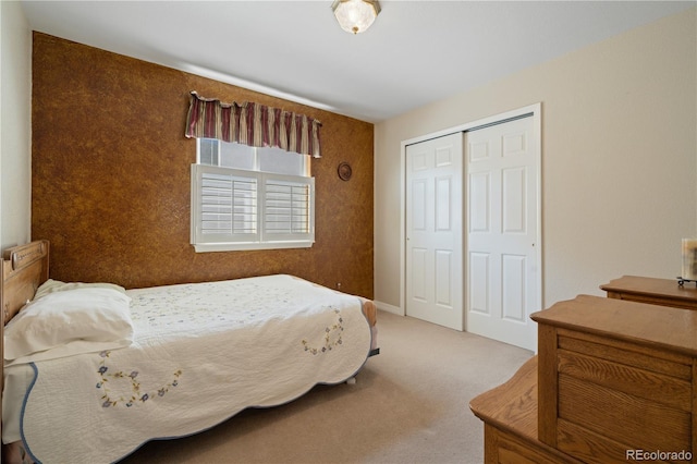 carpeted bedroom featuring a closet