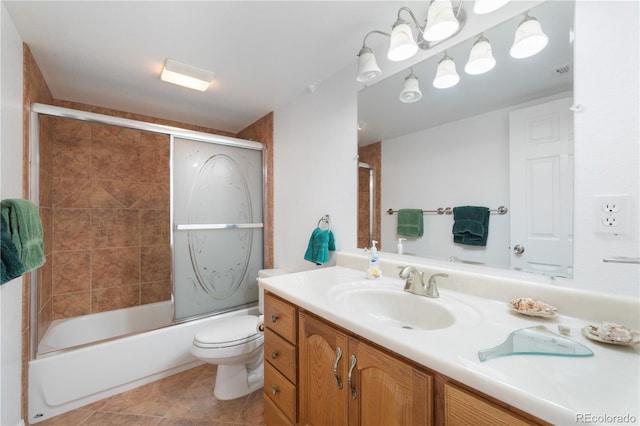 full bath with visible vents, toilet, tile patterned floors, combined bath / shower with glass door, and vanity