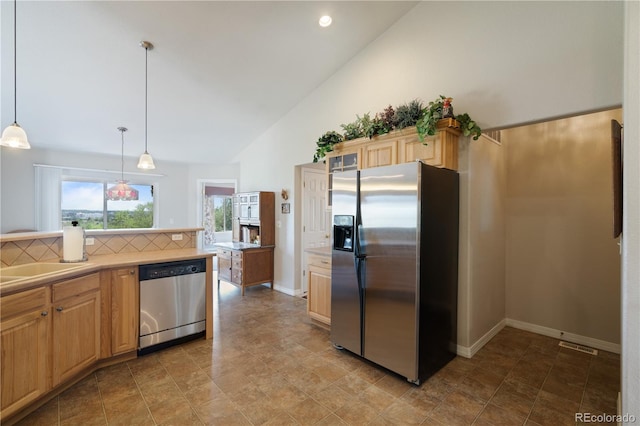 kitchen with baseboards, a sink, stainless steel appliances, light countertops, and backsplash