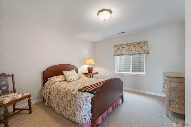 bedroom with visible vents, baseboards, and carpet flooring