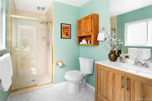 bathroom featuring toilet, vanity, baseboards, marble finish floor, and a stall shower