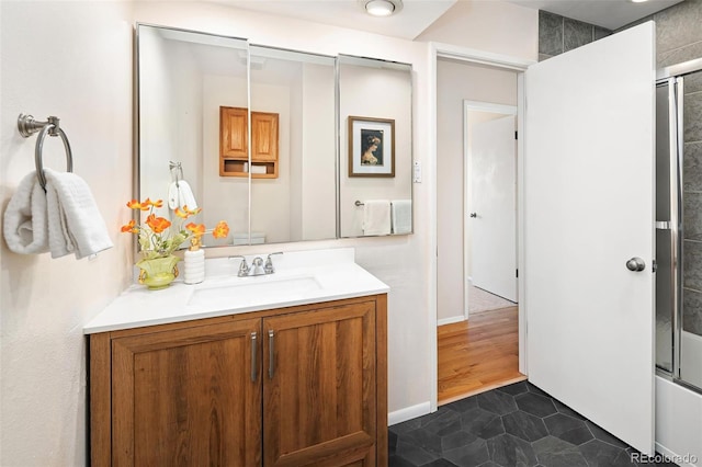 bathroom featuring bathtub / shower combination, vanity, and tile patterned floors