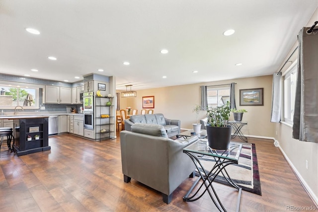 13266 Canopus Dr, Lone Tree, CO 80124 - living room with dark wood finished floors, recessed lighting, and baseboards