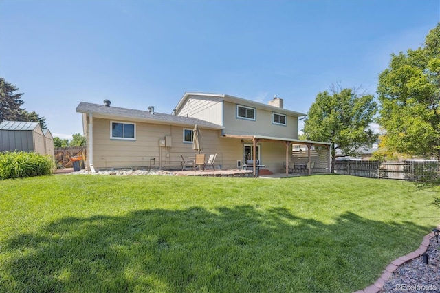 13266 Canopus Dr, Lone Tree, CO 80124 - back of property featuring a patio and a chimney
