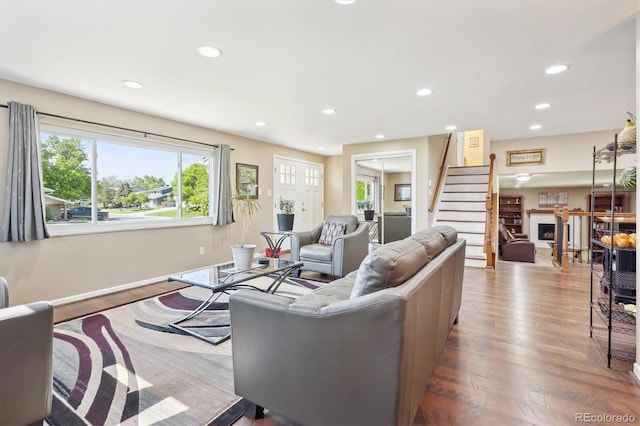 13266 Canopus Dr, Lone Tree, CO 80124 - living area featuring stairs, recessed lighting, wood finished floors, a fireplace, and baseboards