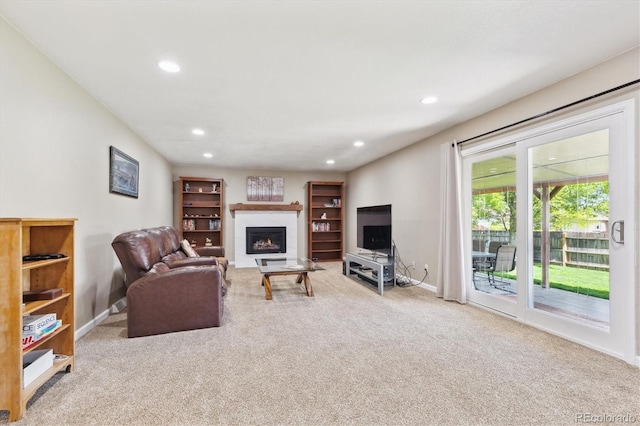 13266 Canopus Dr, Lone Tree, CO 80124 - carpeted living area with a glass covered fireplace, recessed lighting, and baseboards