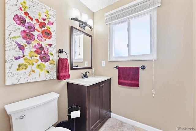 13266 Canopus Dr, Lone Tree, CO 80124 - half bath with toilet, vanity, and baseboards