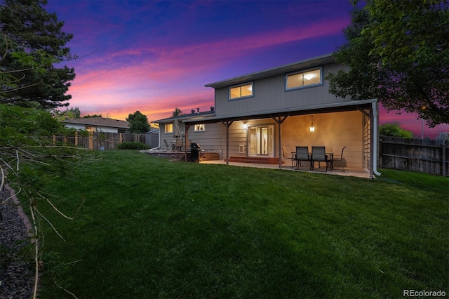 13266 Canopus Dr, Lone Tree, CO 80124 - back of property at dusk featuring a patio