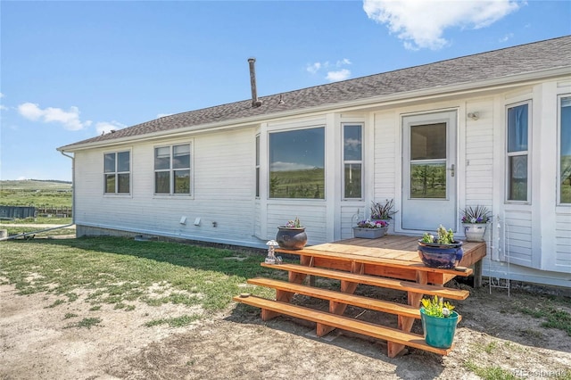 21494 Way Of Peace, Deer Trail, CO 80105 - back of property with a deck and a yard