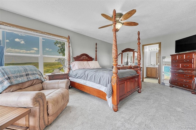 21494 Way Of Peace, Deer Trail, CO 80105 - carpeted bedroom featuring a textured ceiling, ensuite bath, and a ceiling fan