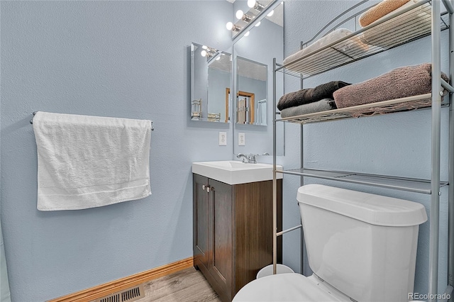 21494 Way Of Peace, Deer Trail, CO 80105 - bathroom featuring vanity, wood finished floors, and a textured wall